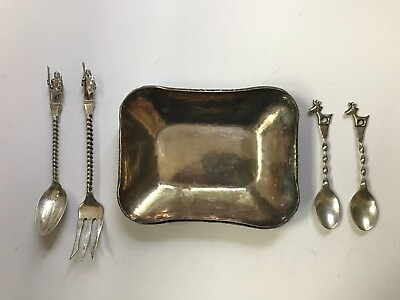 #ad Lot of Peruvian silver spoons and fork and one hand hammered marked silver dish $250.00