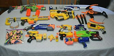 Lot of NERF 12 Guns 1 Bow Attachments Clips Darts Goggles Electronic Target $89.99